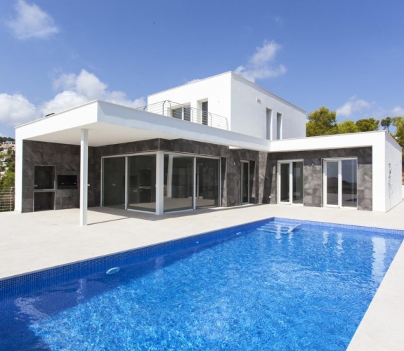 MORAIRA > EL TESORO - A modern style new build villa for sale with panoramic sea views in a new u...