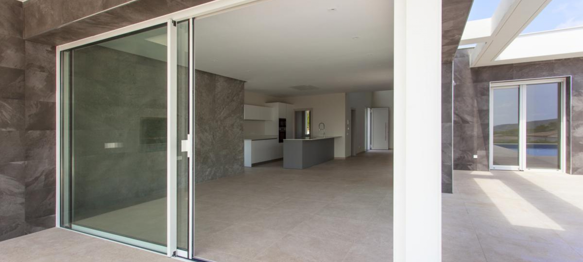 MORAIRA > EL TESORO - A modern style new build villa for sale with panoramic sea views in a new urbanisation.