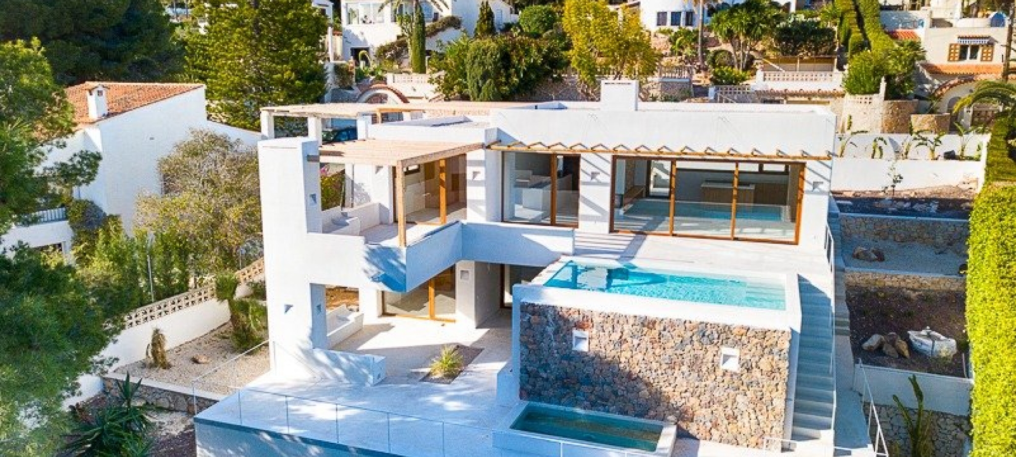 Moderne villa i Ibiza -stil til salg i Pinar del Advocat Moraira med havudsigt