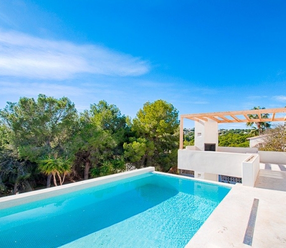 Moderne villa i Ibiza -stil til salg i Pinar del Advocat Moraira med havudsigt